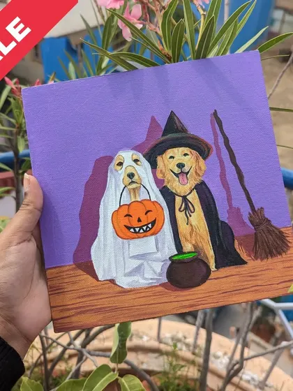 Spooky and sweet. This Halloween-themed painting features two dogs in ghost and witch costumes, perfect for the season.
