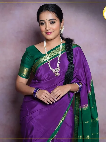 A straight-on view of my recent shoot look. The purple and green saree is paired with neutral makeup to keep the focus on the outfit, showing my ability to create a balanced look.