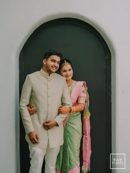 A sweet and relaxed portrait of the couple. The bride's gentle embrace from behind shows their comfortable and affectionate bond.