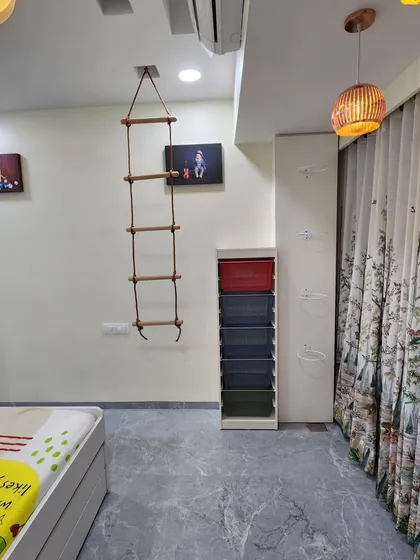 This view shows the storage solutions and the rope ladder in the kids' room.