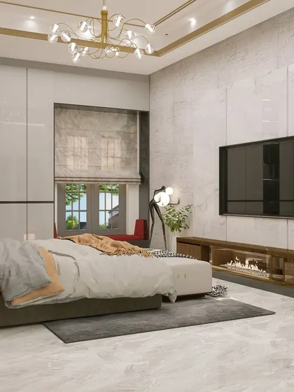 Another view of the 'Golden Glam' bedroom, showing the TV wall and the ample natural light from the window.