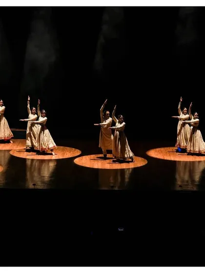 In every footstep, a story unfolds. This image captures the synchronized grace of our Kathak dancers, their movements weaving an enchanting tale of rhythm and expression.