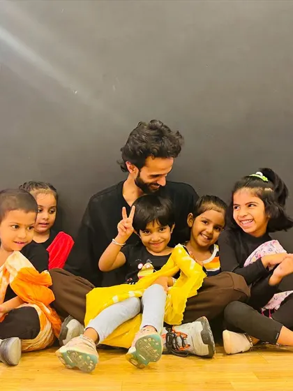 A candid moment of laughter and fun between our instructor and students. We believe a strong, friendly bond with our teachers helps kids learn better and feel more confident.