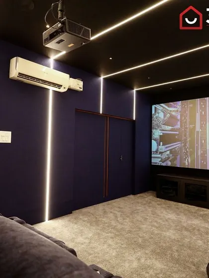 Even in a smaller room, a large screen can create a truly cinematic experience. The minimalist design ensures that the focus remains on the movie.