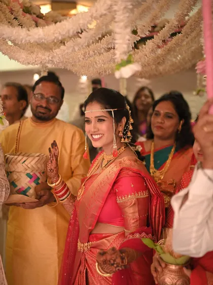 Waving to her loved ones as she makes her entrance. The makeup is flawless from every angle.