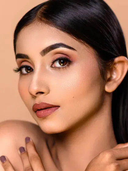 Another example of my high-end beauty retouching. This close-up shows the fine details of the makeup while maintaining a natural and beautiful skin texture.
