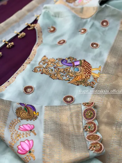 A closer look at the sleeve, showing the fusion of painting and embroidery.