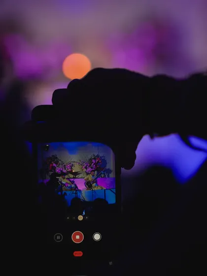A fan capturing the moment on their phone. It's amazing to see the performance through the eyes of the audience.
