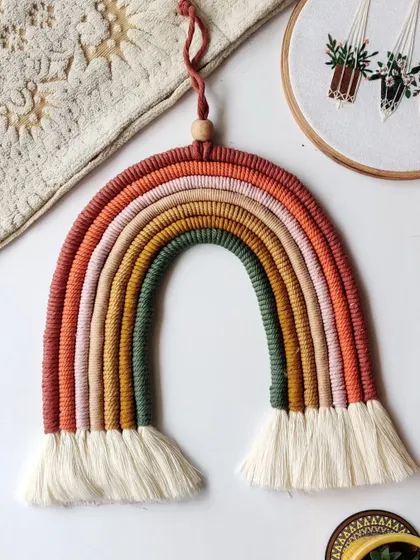 This large, earthy-toned rainbow hanging is one of my favorite custom pieces. The warm, muted colors are perfect for creating a calm and cozy atmosphere in any room.