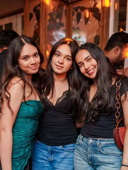 A group of friends posing for a photo, part of the amazing crowd that makes VIBE CHECK the best throwbacks party in Bangalore.