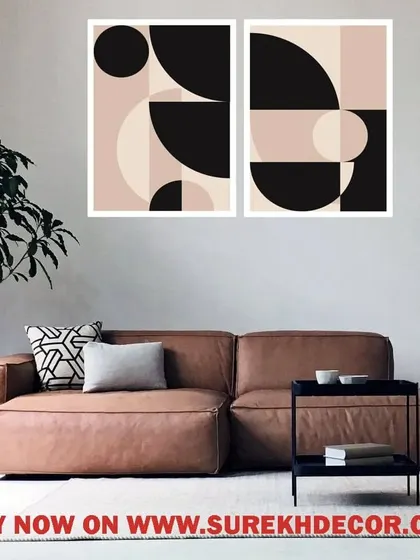 A minimalist set of two framed prints featuring abstract geometric shapes in a soft, neutral palette. This artwork adds a touch of modern sophistication to a contemporary living space or bedroom.