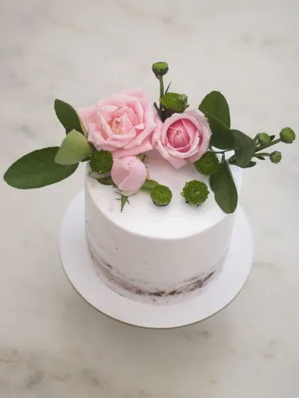A semi-naked cake with fresh blooms, as requested by the client. While I prefer painting my flowers, there's no denying the beauty of fresh ones. I always make sure to prep and seal the stems so they are completely food-safe.