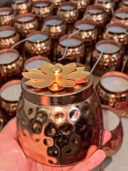 Our copper matki candle with a floral lid is another beautiful option for festive or wedding gifting.