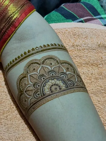 Another view of the mandala arm band, showing the fine details and clean lines.