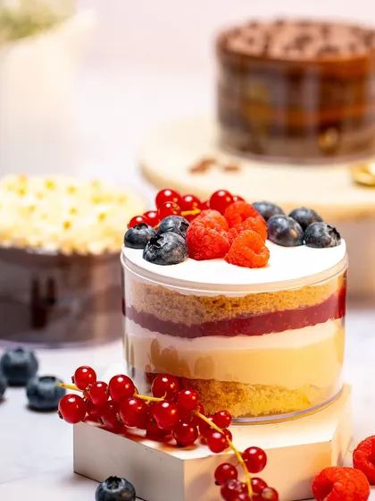 My Fresh Berry Tub is a lighter, fruitier option. It features layers of vanilla cake, cream, and a berry compote, topped with fresh raspberries and blueberries.