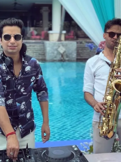 To elevate the experience, I love collaborating with live musicians. Here's a moment from an intimate pool party in Hua Hin, Thailand, where I teamed up with a saxophonist to blend electronic beats with live, soulful saxophone notes.