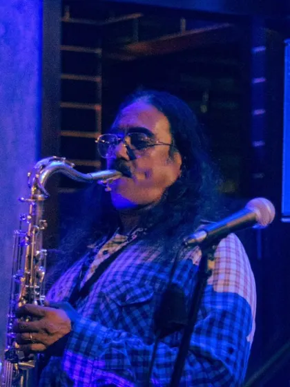 The saxophonist from The Chronic Blues Circus, lost in the music. We love hosting live performances that get you grooving.