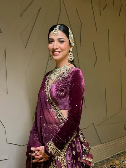 A closer look at this bride's stunning wedding day glam. The focus was on creating a luminous base that allowed her natural beauty to shine, complemented by her intricate jewelry and elegant hairstyle.