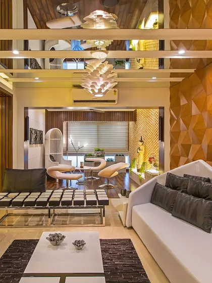 A luxurious living room with a 3D-paneled wooden accent wall, a mirrored ceiling, and modern white and black furniture, creating a high-impact, statement look.