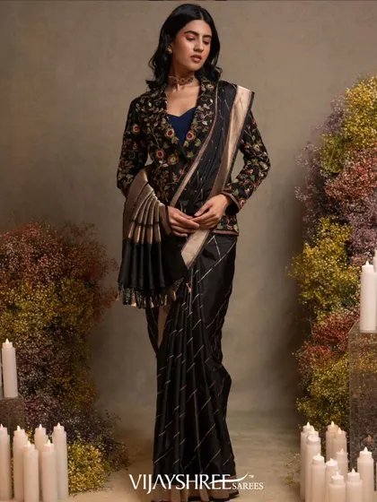 The full look of the black Banarasi saree with the jacket, a perfect fusion of traditional fabric and contemporary styling.