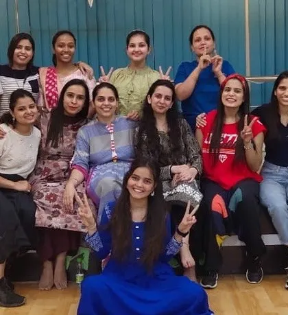 A pre-color group photo from our Holi event, with everyone excited and ready to celebrate.