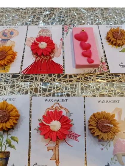 I also create these charming handmade wax sachets. They are a wonderful, flame-free way to scent smaller spaces like wardrobes or drawers, and they come in a variety of artistic designs.