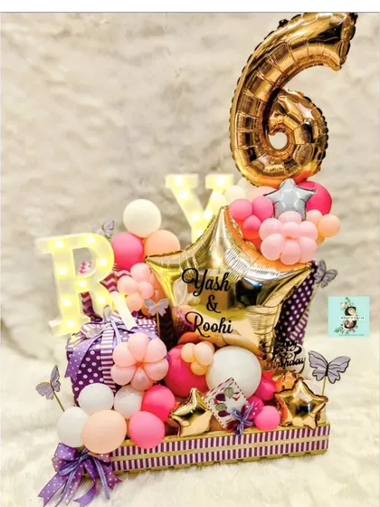 I had so much fun working on this birthday hamper for Yash and Roohi Johar's 6th birthday. It’s filled with amazing gifts and decorated with personalized balloons and marquee lights.