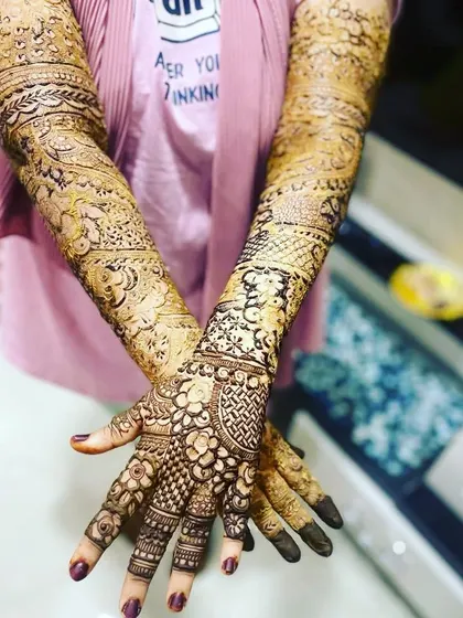 A full view of a heavy bridal design, showing how the intricate patterns look from a distance.