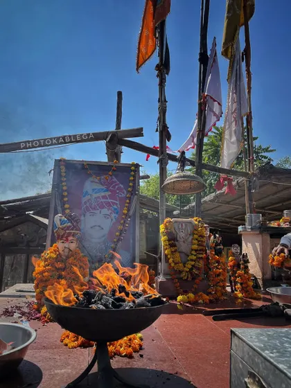 The shrine at Om Banna Temple, with a sacred fire burning before a portrait of Om Banna.