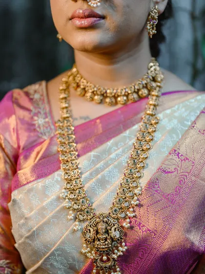 A detail shot of the bride's stunning temple jewelry, a key part of her South Indian bridal look.