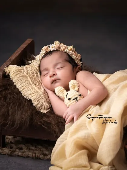A duplicate of image 86, a peaceful and rustic newborn portrait.