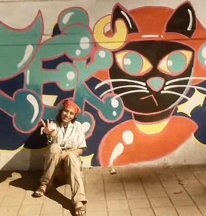 Another shot of me with the cat graffiti, feeling the accomplishment of another late-night painting session.