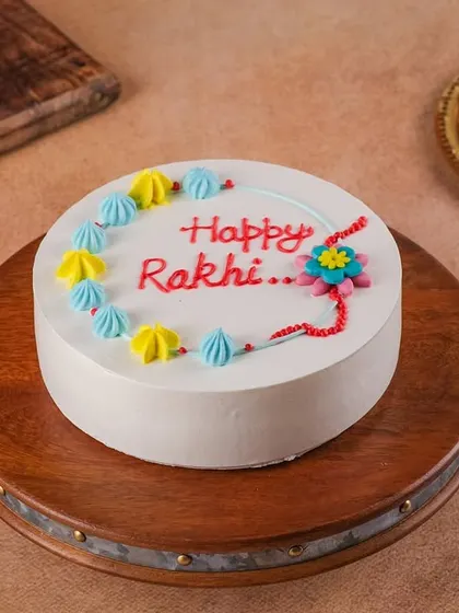 Our simple and sweet "Happy Rakhi" cake is perfect for your Raksha Bandhan celebration. It features a cute, edible rakhi design and colorful frosting.