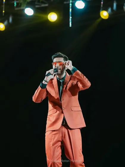 Adjusting my glasses on stage, a small gesture that's part of the performance and my on-stage persona.