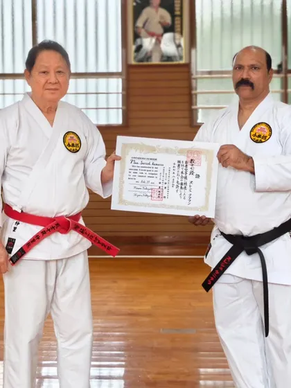 I am pictured here with my teacher, Hanshi Minoru Nakazato, upon receiving my Kyoshi Nanadan (7th Dan) certification in Okinawa, Japan. This connection to the direct lineage of karate is the foundation of everything I teach.