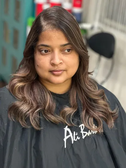 From a box dye to art. This color transformation resulted in a beautiful, multi-tonal brunette look with soft waves and a healthy finish.
