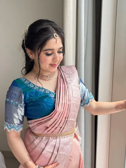 Looking out the window, Payal's makeup catches the light beautifully.