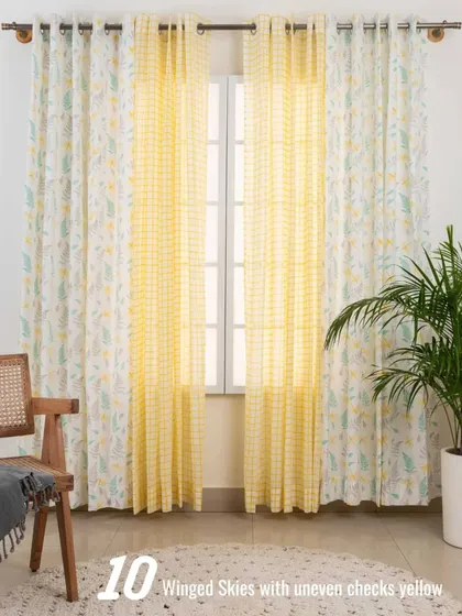 Brighten up your room with this sunny combination of our Winged Skies curtains and yellow uneven checks sheer. This pairing is perfect for creating a happy, light-filled space that feels welcoming and full of energy.