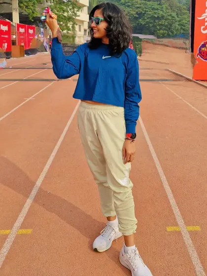 A proud moment on the track after the Pune International Marathon, securing 7th internationally and 4th in India. She is the storm and the calm.