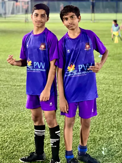 Two boys, one team. The friendships forged on our pitch are as important as the skills learned.