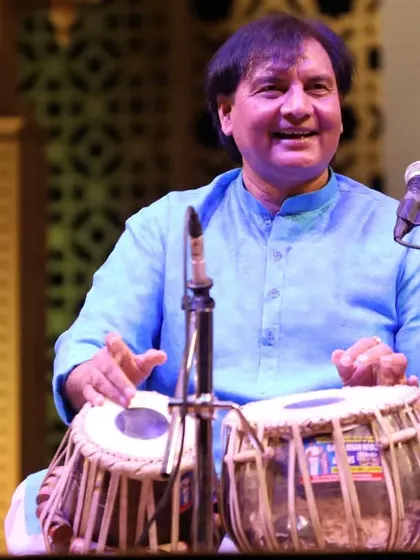 A smile during a performance is a sign that the audience and the artist are connected as one. This was captured during a tabla duet, a moment of pure happiness in the flow of rhythm.