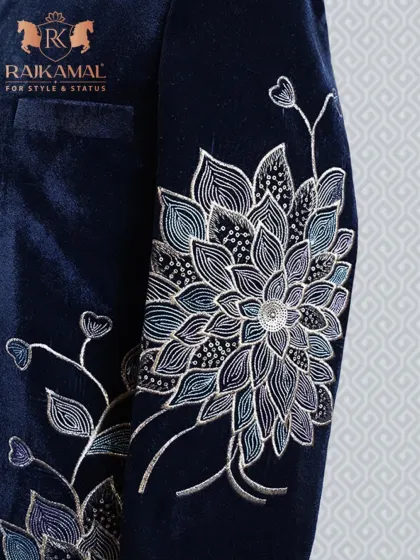 A detail of the floral embroidery on the sleeve of the navy blue velvet Bandhgala.