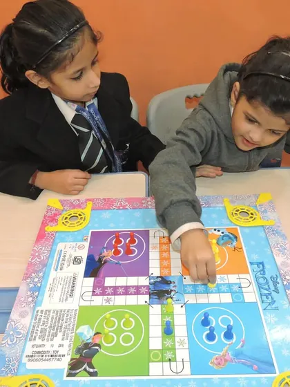 Students learn teamwork and friendly competition through board games during a day dedicated to non-digital activities.