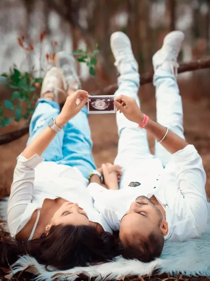 Another creative angle for an outdoor announcement photo. This playful pose is fun and captures the joy of the moment perfectly.