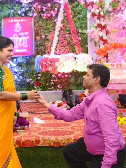 A different angle of the sweet, romantic gesture between the couple.