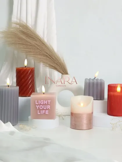 Here is the full view of our new collection of battery-operated and traditional pillar candles. The variety of shapes, from spiral to ribbed to a "Light Your Life" message candle, shows our commitment to design.