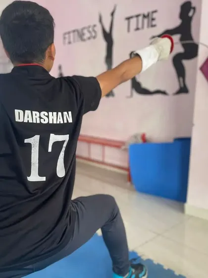 This image captures the focus and determination of a fencer in the middle of a lunge. The personalized jersey shows the pride our students take in being part of the club and their commitment to the sport.