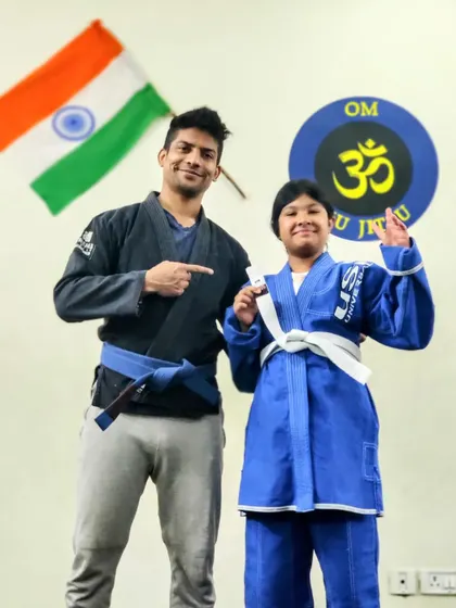 A proud moment for this young warrior. Her new stripe is a symbol of the hard work and progress she has made on her Brazilian Jiu-Jitsu journey.