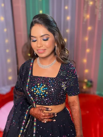 A closer look at the colorful smokey eye. The blend of blues and shimmers makes a bold statement, perfect for a themed party night.