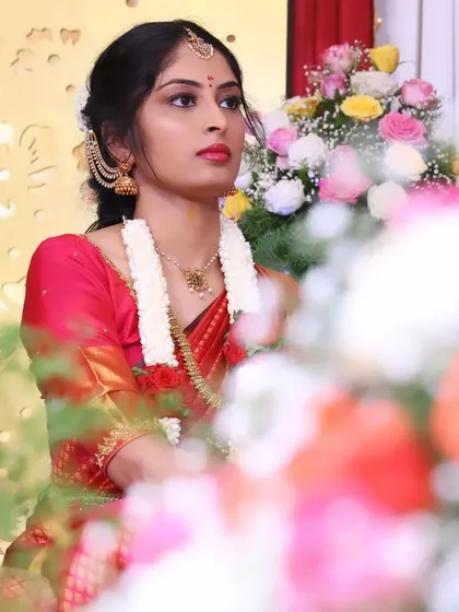 Another angle of Akshatha's engagement look. The makeup is focused on creating a flawless complexion and defining the eyes, which works beautifully with her traditional attire and jewelry.